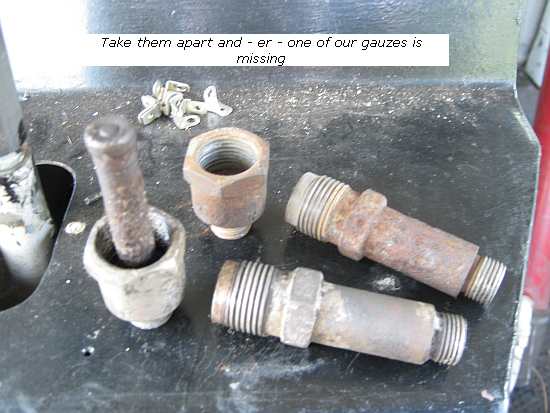 Filter assemblies taken apart - one missing its gauze