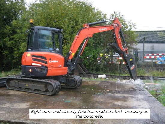 Digger breaking the old concrete