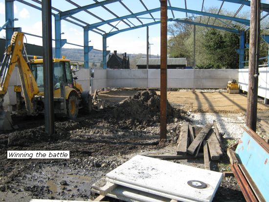 Shed Construction slowly winning against the mud
