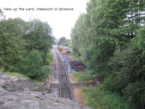 View of yard, shed steelwork in distance