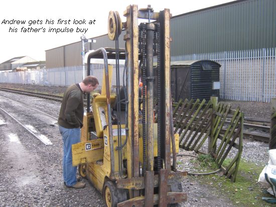 Andrew looking over the "new" forklift