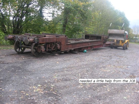 JCB urging well wagon to descend onto Peak Rails