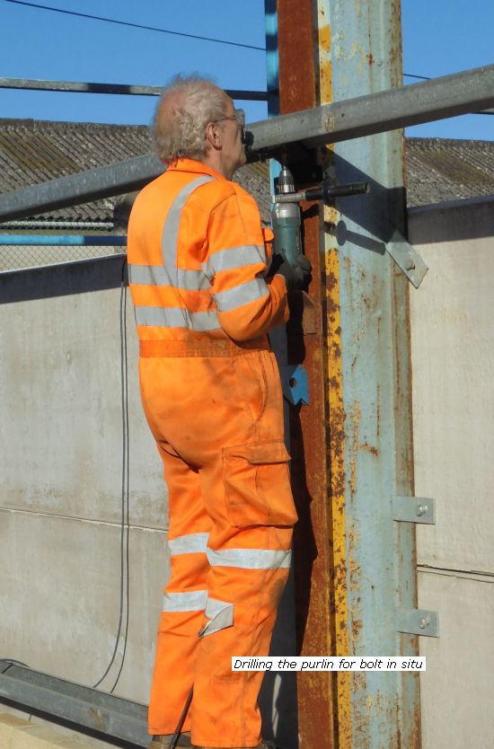 Pete drilling the purlin in situ for bolts