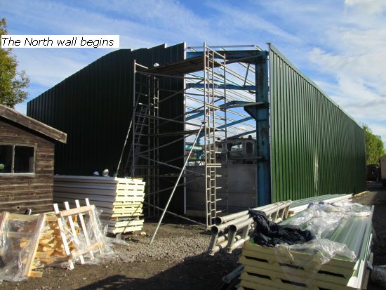 Cladding the north wall begins