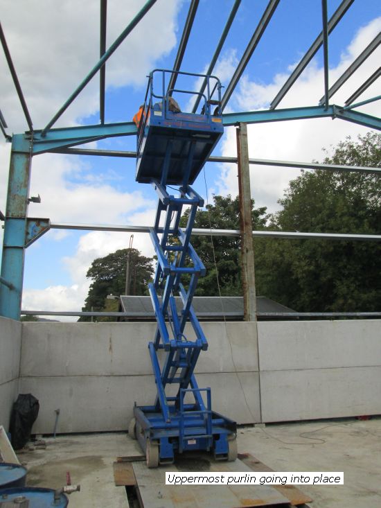 Scissor lift aids purlin fitting