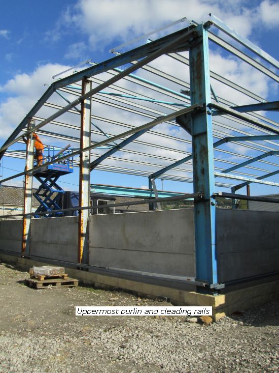 Uppermost purlins and cladding rails