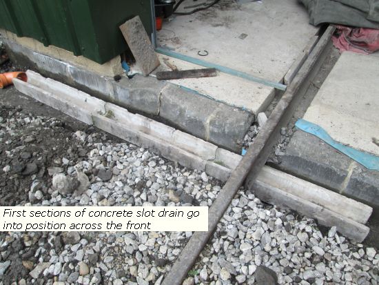 First sections of concrete slot drain fitted