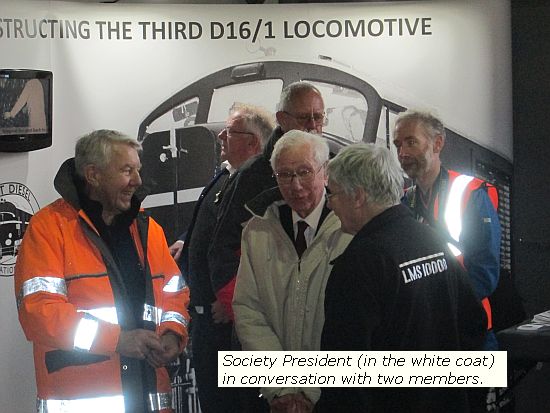 At Ivatt Diesel Re-creation Group's new workshop, Winksworth, group President (white coat) chats to members