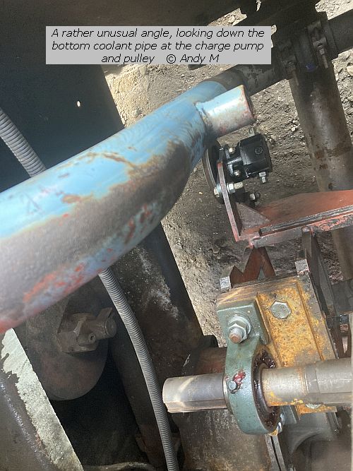 A rather unusual angle, looking down the bottom coolant pipe at the chrage pump and pulley copyright Andy M