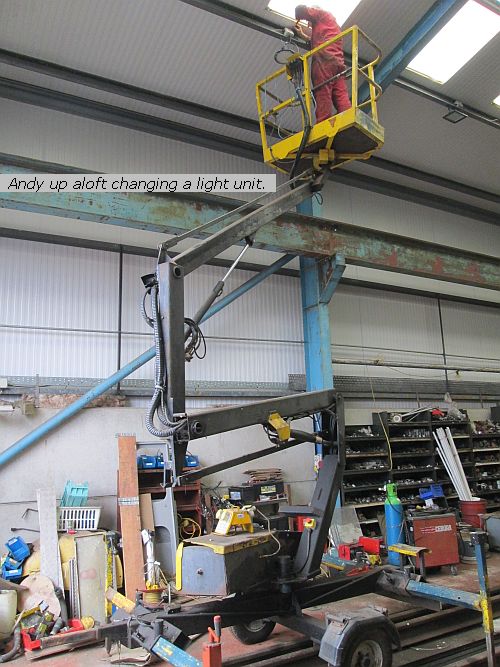Andy H on cherry picker changing a light unit