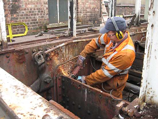 Beverley - Andrew, suitably PPE'd, cleaning around the front cross-stretcher