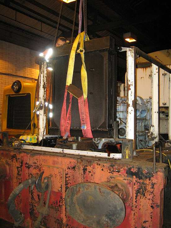 Andrew secures the top of the rad before the slings are removed