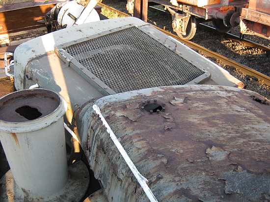 D2128's casing tops and nose cone piled together on a wagon