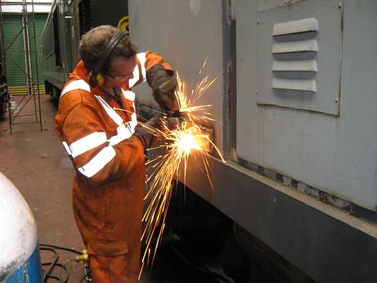 Grinding the welds flat on Libby's cab side