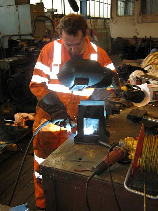 Andrew assembles the plummer block support